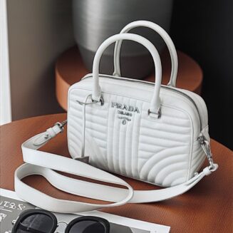 Prada
White Quilted Leather Diagramme Top Handle Crossbody Bag